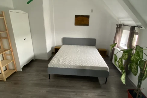 Comfortable bedroom with modern furniture, available in 1 bedroom apartment
