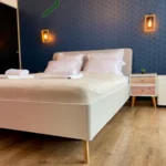 Comfortable bedroom with modern furniture, available in 1 bedroom apartment at 9 Gheorghe Magheru Boulevard, 9th floor, Bucharest.